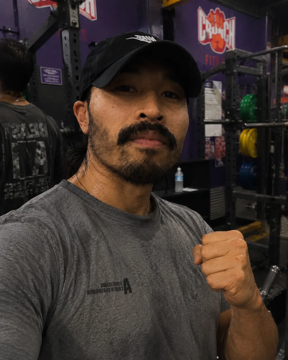 Coach Tri on the gym floor, mid-session
